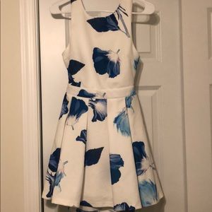 White dress with blue flower detail